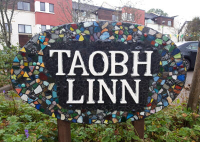 Photo of tiled taobh linn sign